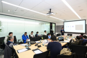 a group of people sitting at a desk