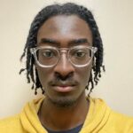 Chukwuebuka (Buka) Dikeocha wearing glasses