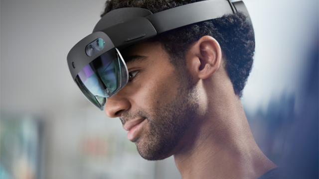 Lifestyle image of male wearing a Hololens 2 device