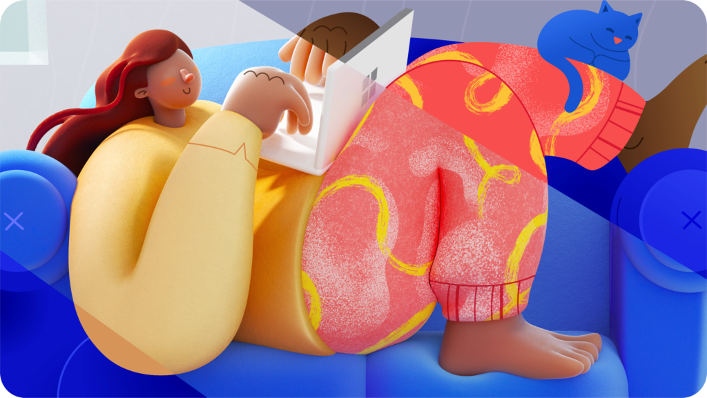 person on couch working with laptop