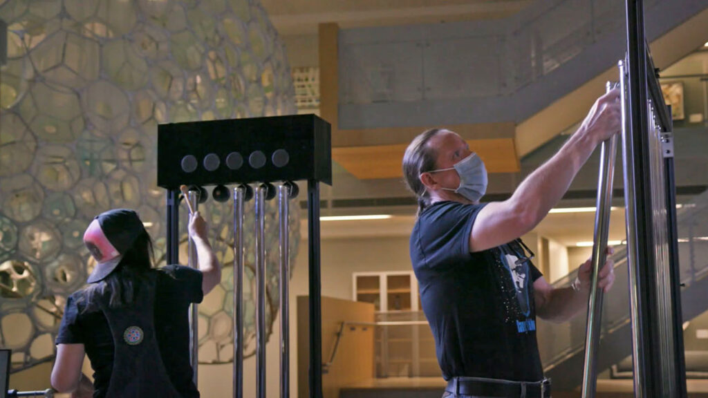 two people setting up the Galactic Bell Star music demo for Microsoft Expressive Pixels