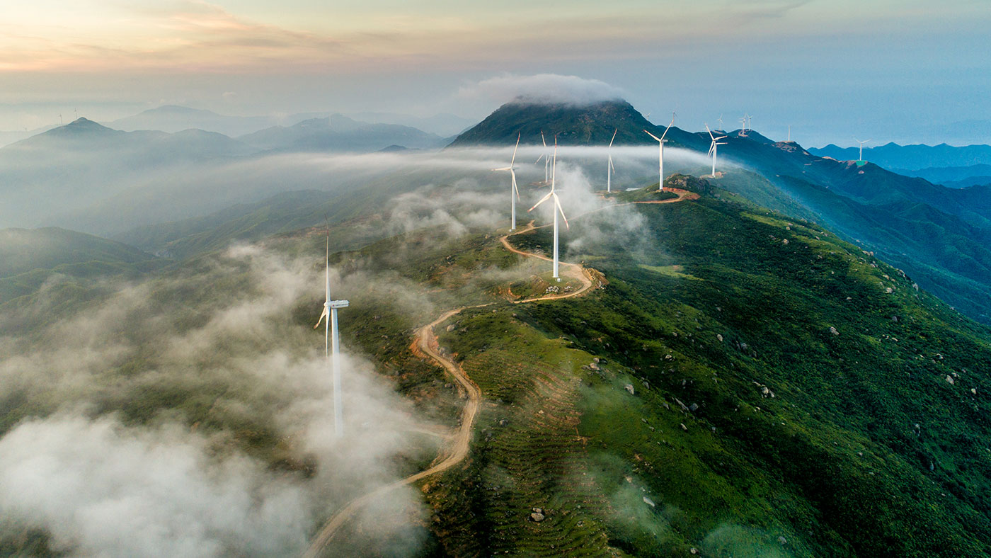 aerial view of a mountain top wind farm