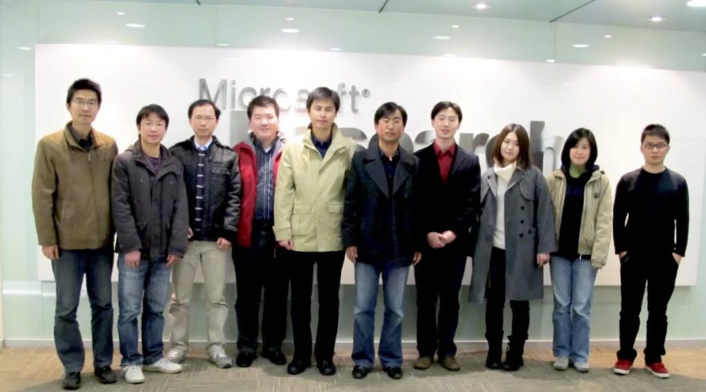 a group of people posing for a photo