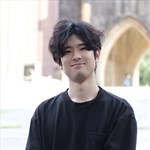 a man standing in front of a building