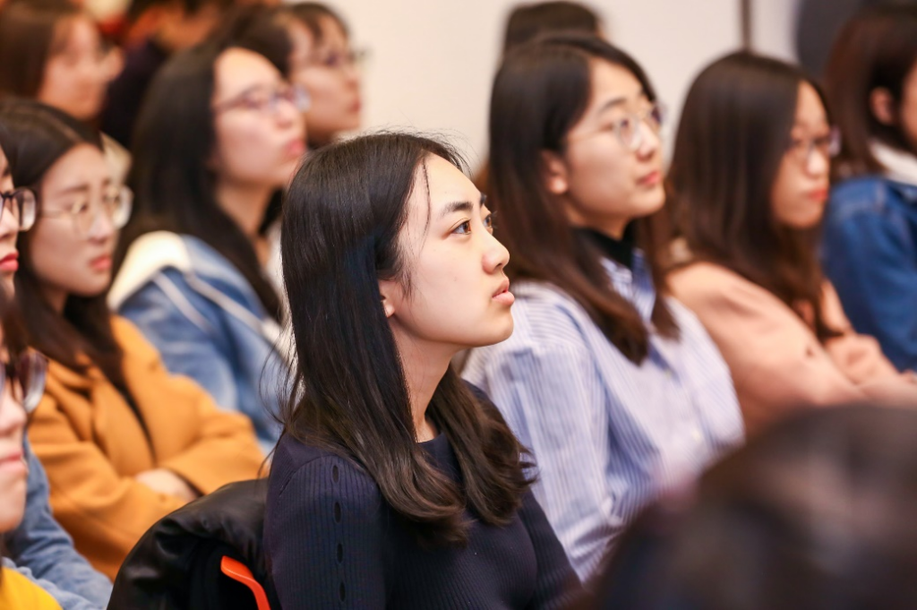 a group of people standing in front of a crowd