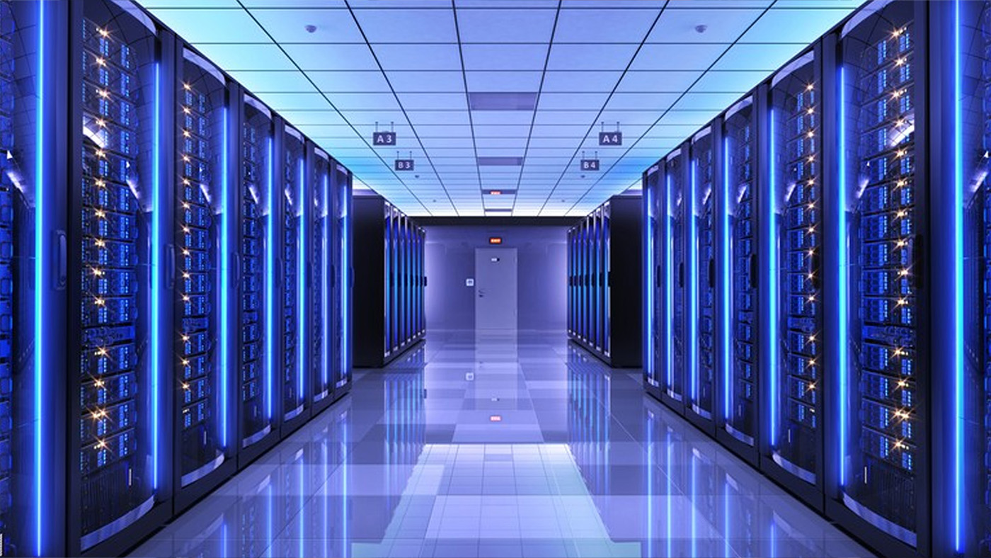 a blue-lit hallway of servers