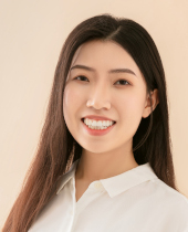 a woman smiling and posing for the camera