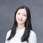 a woman wearing a purple shirt