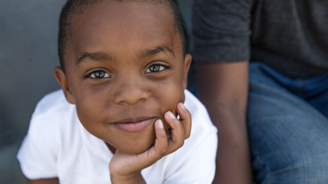Project Kahani header image - young boy looking mesmerized by the camera