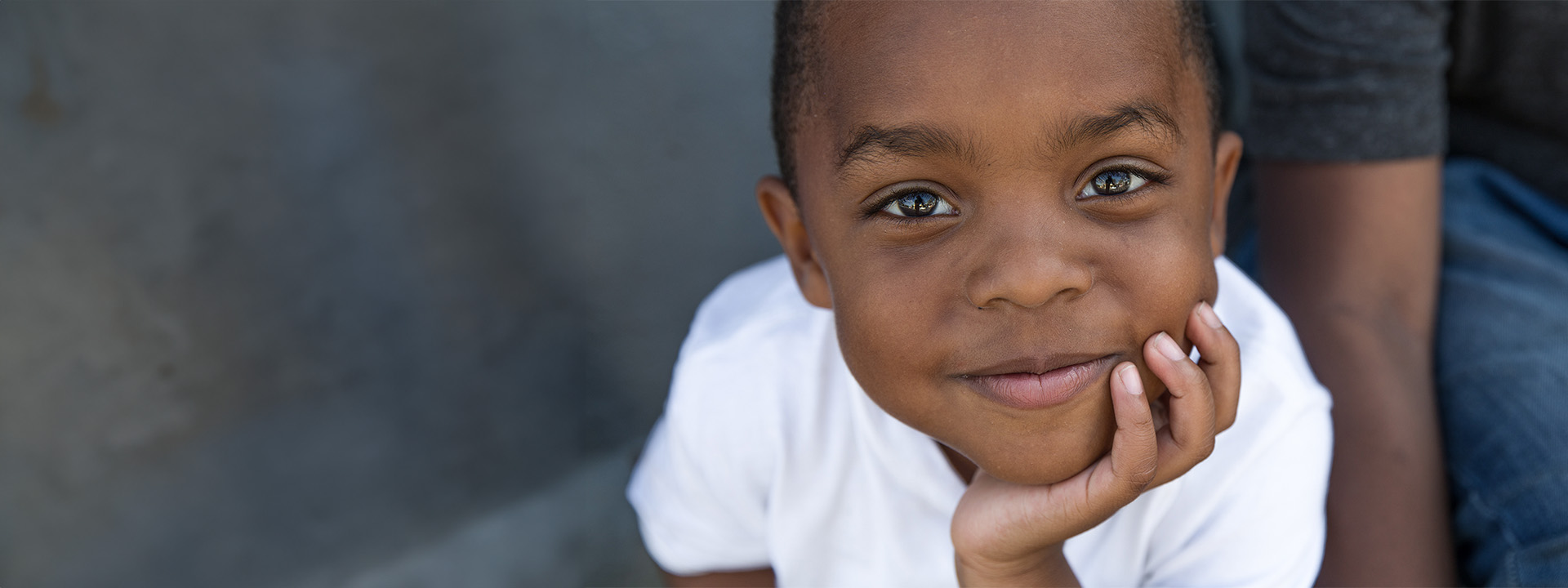 Project Kahani header image - young boy looking mesmerized by the camera