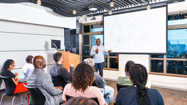 a researcher giving a presentation to a group of people