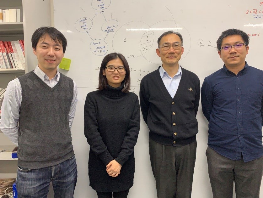 a group of people posing for a photo