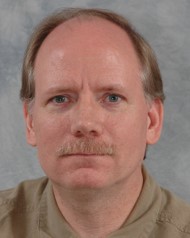 a man smiling for the camera