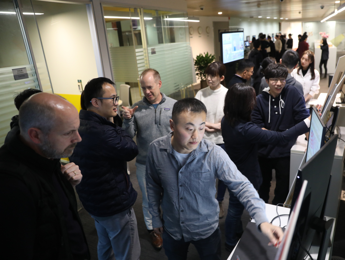 Doug Burger et al. standing in a room