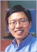 Harry Shum wearing glasses and smiling at the camera