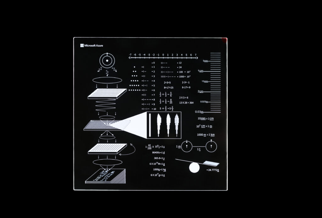Silica glass platter containing descriptive instructions related to the Avenues Golden Record 2.0 project