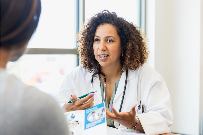 image of a nurse and patient reviewing a brochure