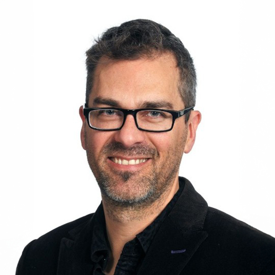 Mark Perry smiling for the camera