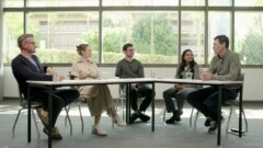 a group of people sitting around a table
