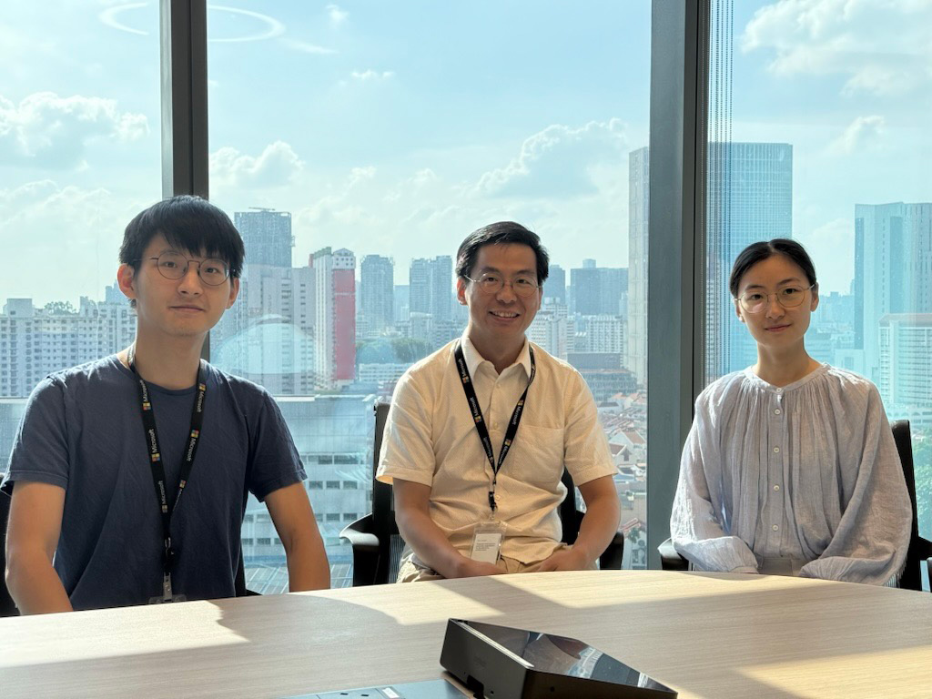 Xingxing Xu (center) with colleagues at Microsoft Research Asia - Singapore 