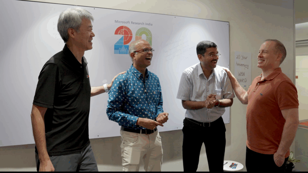 Peter Lee, Sriram Rajamani, Venkat Padmanabhan, and Doug Burger standing together smiling