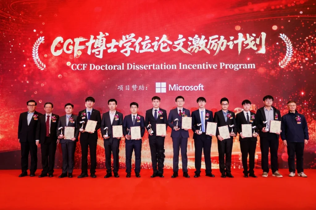 Presenting certificates to award-winning PhD students and their supervisors