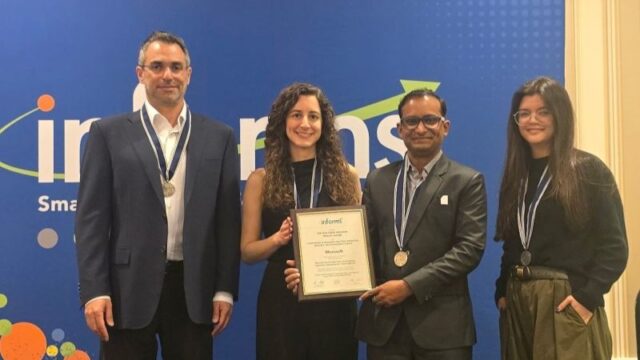 a group of people holding a certificate