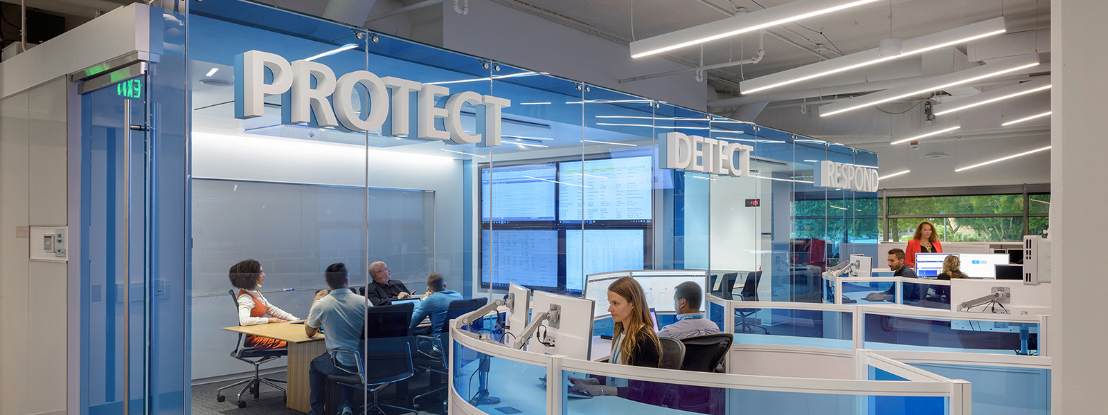 People working outside a security department.