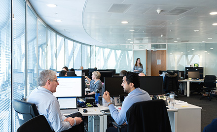 Image of a bustling tech office.