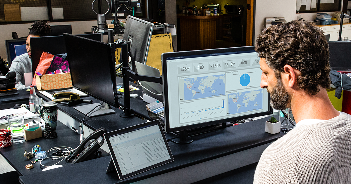 Image of a man working at his desktop PC.