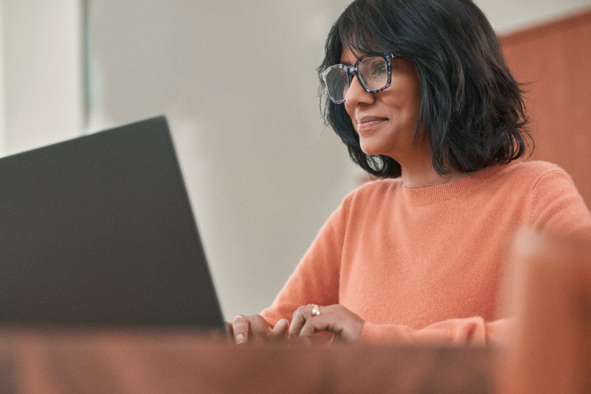 Adult woman working on laptop.
