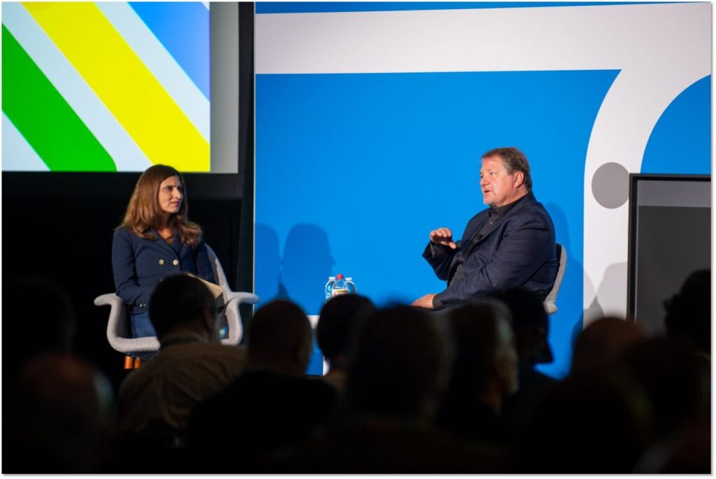 Vasu Jakkal and Bret Arsenault  on stage at the Microsoft pre-event. 