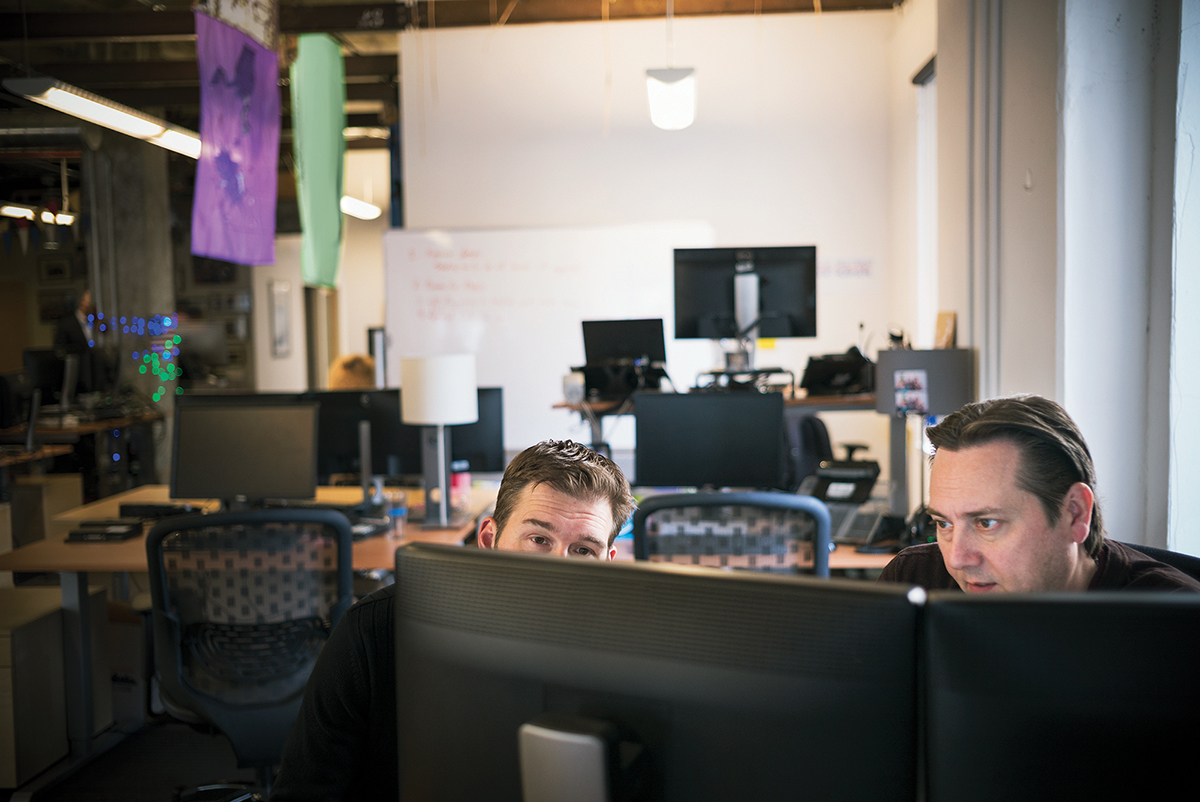 IT professionals at a digital consulting firm. The firm provides custom solutions across a multitude of disciplines including IT, front and back end software development, customer support and data services.