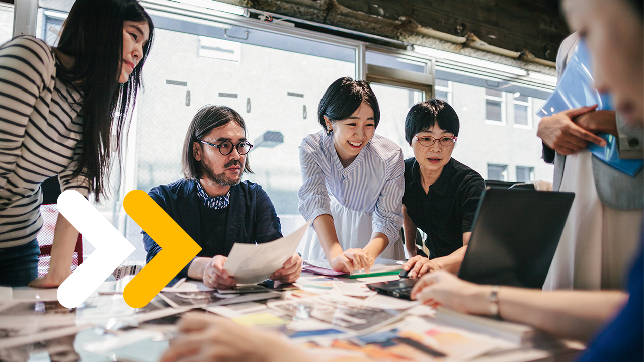 Group of people are working together in a modern working space in Tokyo.