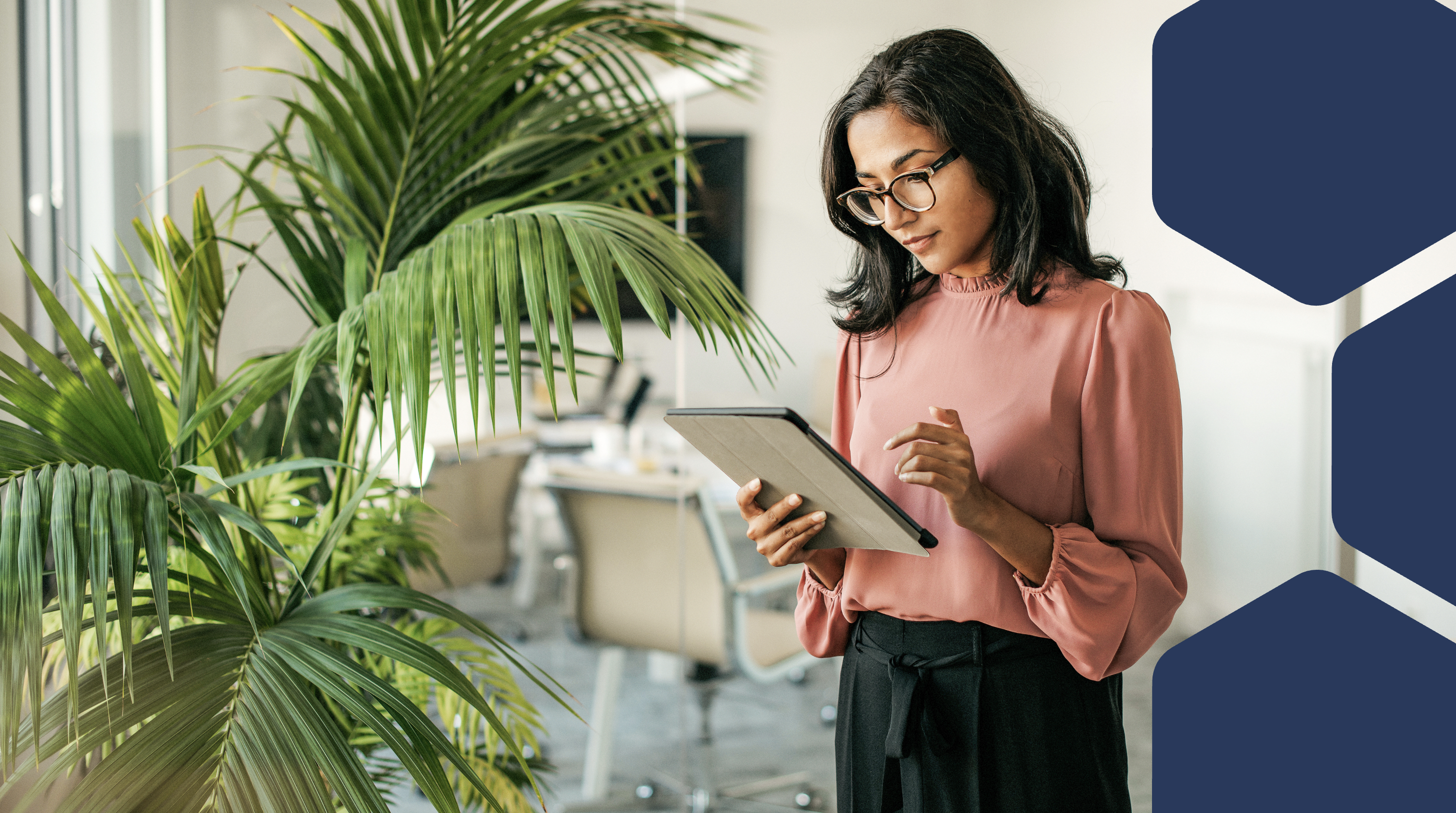 A woman holding a tablet