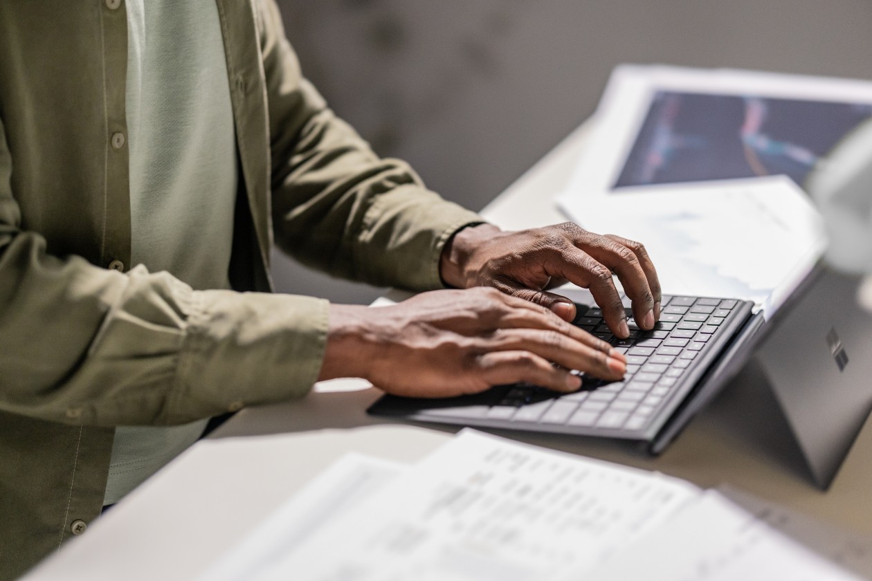 A person typing on a keyboard