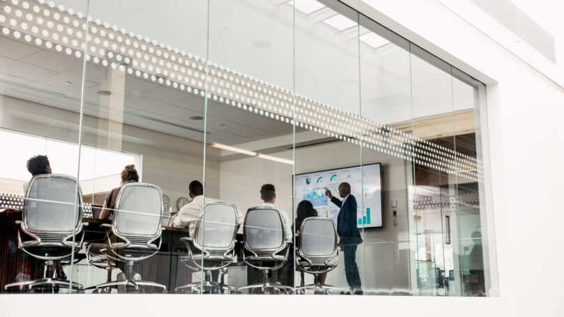 A group of people in a meeting room