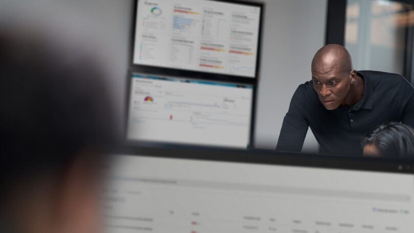 Chief information security officer collaborating in a security operations center.