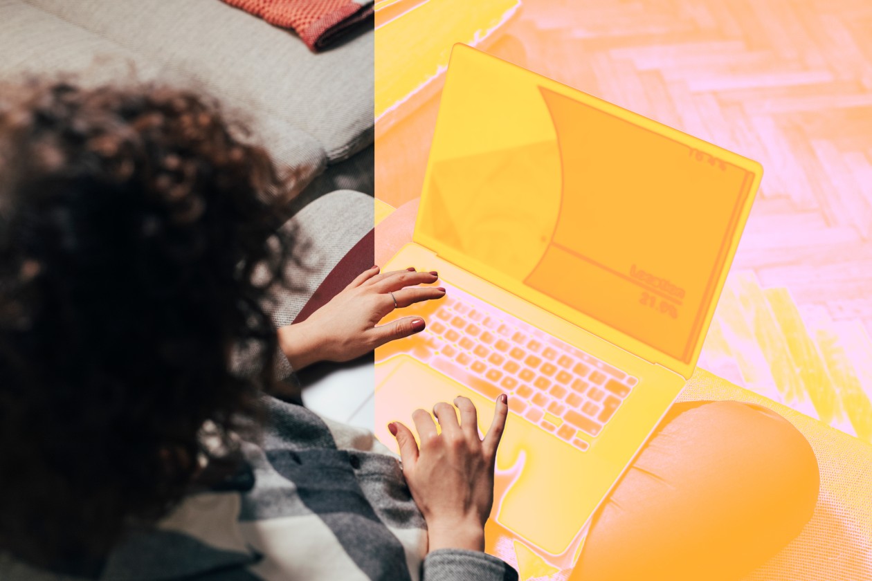A person typing on a laptop.