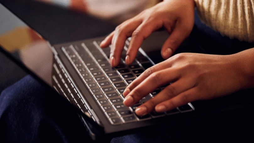 Female developer typing on a keyboard