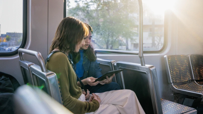 Students in focused work on the bus.
