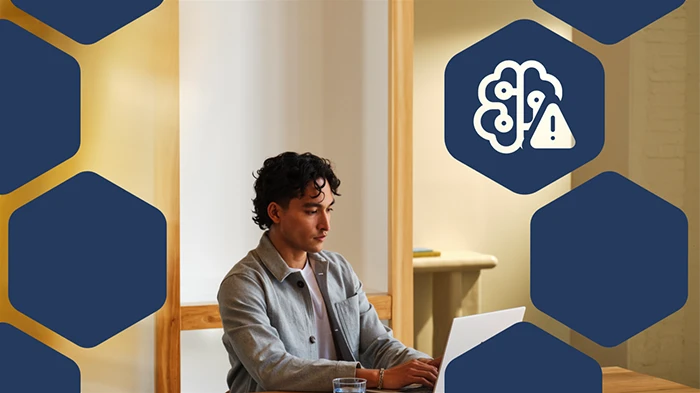 Photo of user on a computer, with hexagon icons overlaid