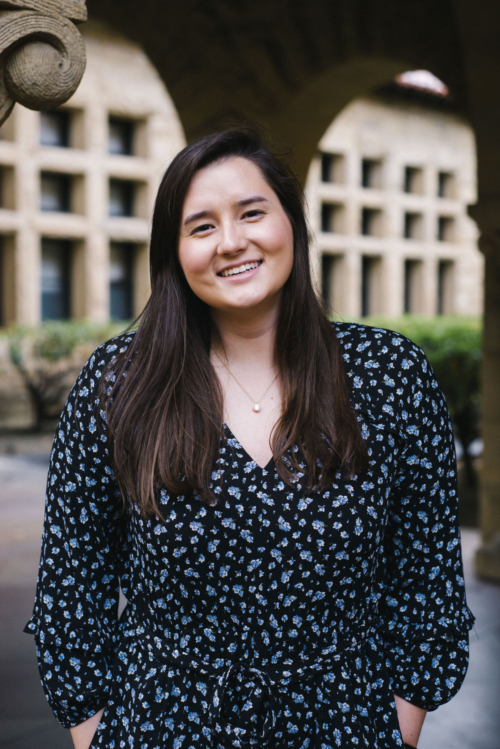 Professional headshot of Brittany smiling at the camera