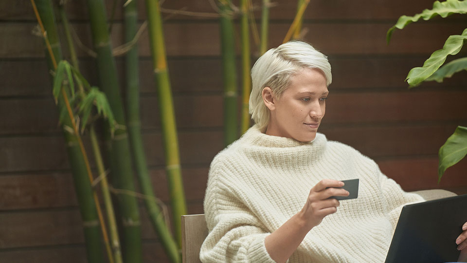 A woman looking at a laptop