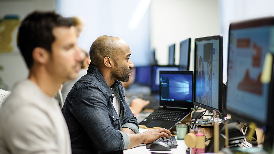 Employees working at computer workstations
