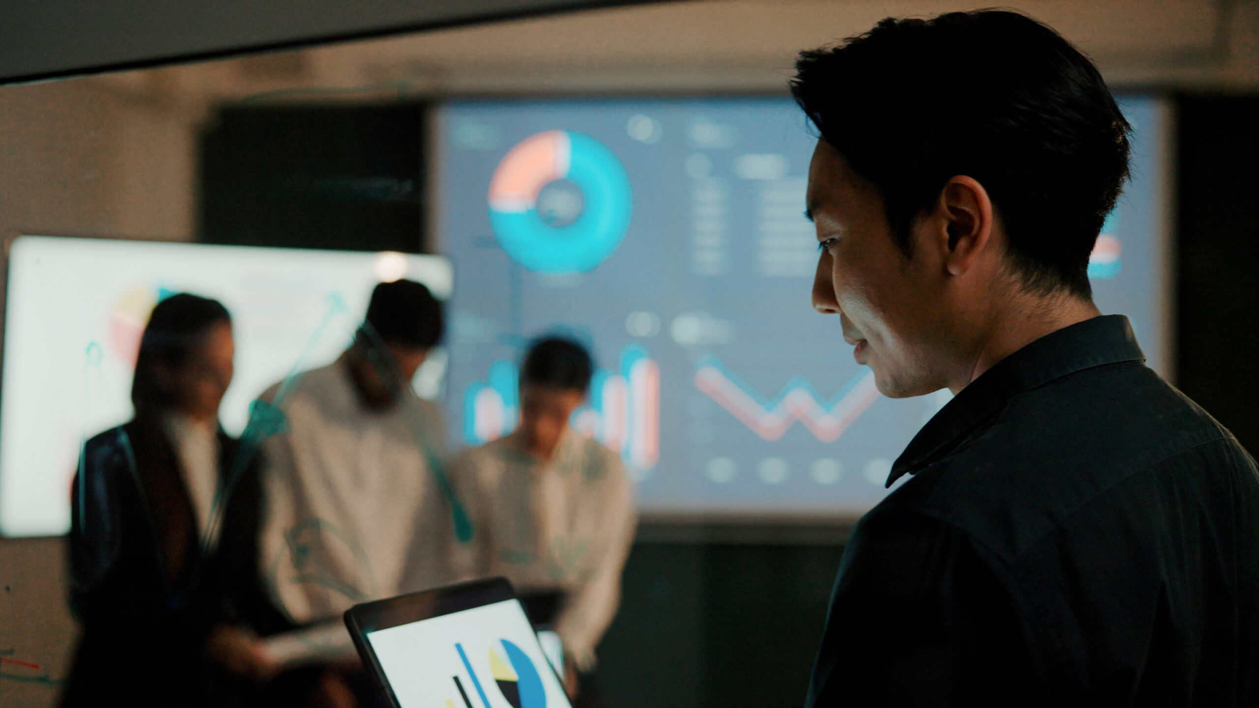 Man preparing presentation on laptop.