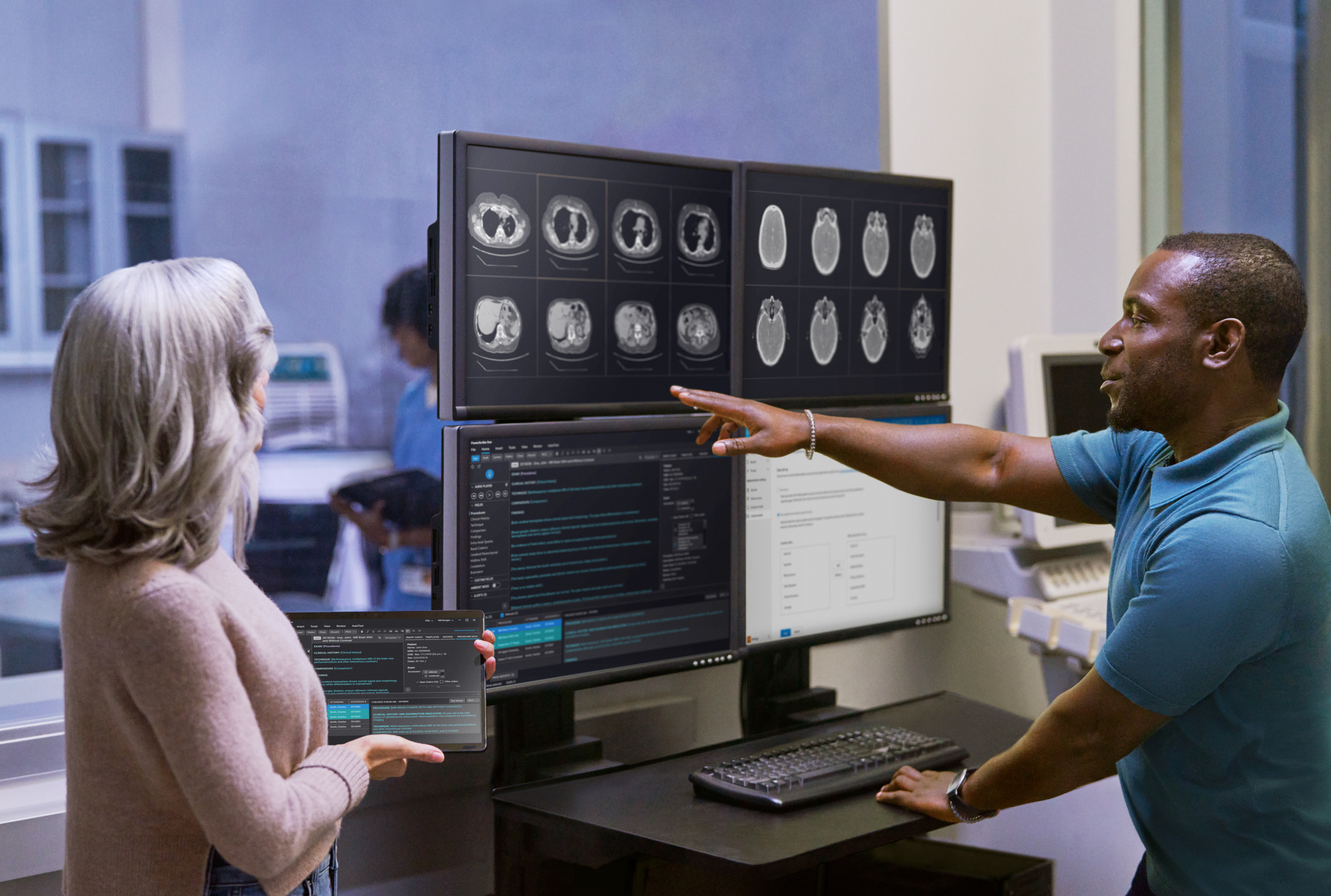 Clinicians looking at medical scans.