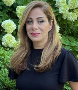 Hafezi smiles in a portrait photo.