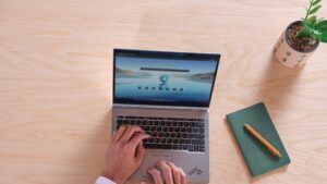 Image of an employee sitting at a computer getting ready to use internal search on their PC.