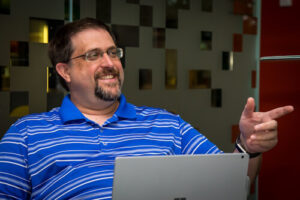 Patton smiles in a portrait photo.